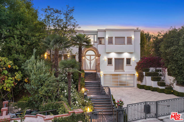 3195 Deep Canyon Drive Beverly Hills, California Welcome to the Deep Canyon Estate! Nestled away this stunning contemporary is perched on Deep Canyon close to Mulholland. The home welcomes art enthusiasts with it's high vaulted ceilings and natural light throughout makes it perfect for exhibiting private collections. The beautiful limestone floors go beyond your formal entryway, leaving each visitor feeling refreshed! This home includes a state-of-the-art kitchen, family room, large formal living room, formal dining area and a spacious backyard with a pool perfect for a Summer day! The main bedroom includes beautiful western views and a spacious main bathroom complete with a spa tub! Bonus features include a wine cellar, media room, private gym and beautifully landscaped grounds!