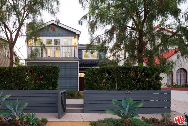 1067 Van Buren Avenue Venice, California This designer home is just a short distance to the beach, world renowned shops on Abbot Kinney, outstanding restaurants including Scopa, Night+ Market, Gjelina, as well as the esteemed Coeur D' Alene Elementary School. It's the complete package - dramatically remodeled and expanded in 2015, there was no expense spared on finishes, high end appliances, integrated sound system, and top notch broadband connections in every room. Upstairs features a gorgeous master bedroom with vaulted ceiling and fireplace, luxe bath with tub shower and double sink, walk in closet, and deck, plus two additional generous size bedrooms, bath and a laundry room. Downstairs hosts a living room/dining room with sliding barn door, a separate guest suite, powder room, office, a beautiful and well appointed kitchen/family room. Outside, a converted garage adds flex space and plenty of storage, and the professional landscaped garden offers plenty of room to relax, dine outside and enjoy the ocean breezes.