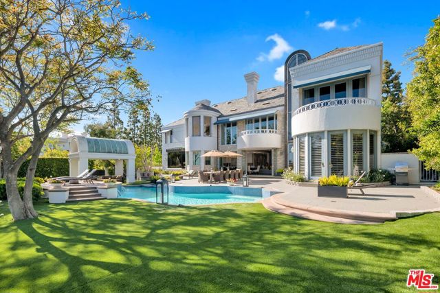 2496 Lancelot Lane Los Angeles, California This architectural custom home within the exclusive gated enclave of Bel Air Crest invites a peaceful lifestyle of in and outdoor living. Serene views of the canyon to the ocean compel one to live and enjoy the private landscape, pool and gazebo of the rear yard right off the family room and gourmet kitchen. The floorplan lends itself to entertainment and a luxury lifestyle with all the amenities of resort living. Each of the bedrooms are suites with an oversized bonus room. Entry to this exclusive home is graced by a koi pond and succulent landscaping. This location is premier in this community complete with tennis courts, gym, club house, putting green, playground and security.