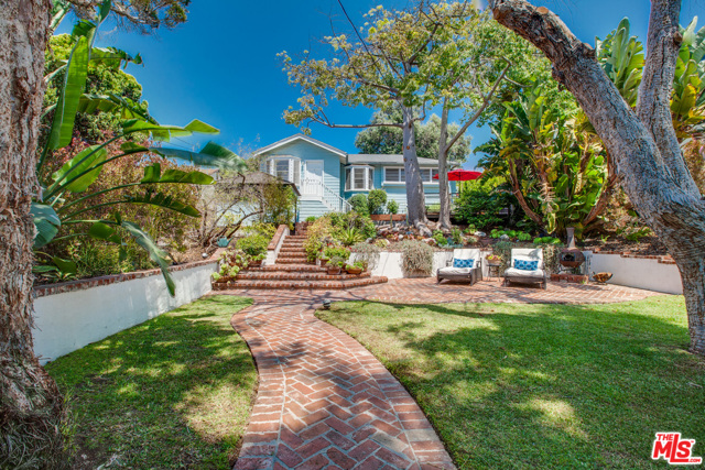 715 Pier Avenue Santa Monica, California Hidden behind an Ivy covered wall, discover your own multi-terraced, garden oasis, with a charming, move-in ready 1938 Beach Cottage. This is your chance to own a home with an enormous yard, west of Lincoln, in Ocean Park, Santa Monica. Perched atop the hill on Pier Ave, this well maintained 2 bedroom, 1 bathroom home sits on a 5488 square foot lot. Live here now and embrace the Ocean Park lifestyle - walk or bike to the Beach, to Main Street, Rose Ave, Abbot Kinney and the latest eateries on Lincoln Blvd. It is also zoned SMOP2, which presents great potential for expansion or development. Build up, out or do a complete redevelopment on your own timeline. This is a great opportunity & a magical spot.