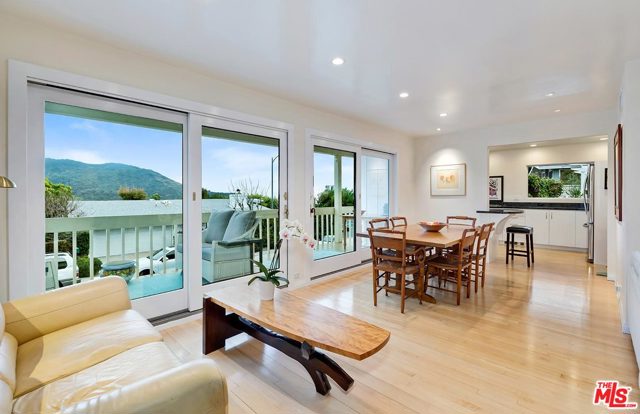 1341 DUENDE Lane Pacific Palisades, California Vibrant home in a magical setting with 180 degree views of mountains, downtown LA, twinkling city lights from both levels with three bedrooms & 3 newly remodeled baths+detached studio (10'x 12'). Updated kitchen w/SS appliances, granite counters, custom cabinetry. Open living-dining room floor plan leads to grand balconies and side yards on 1st level. Up are master suite +2 BR sharing a bath, balconies off all BR and access to a rear terrace amidst trees with fantastic views. Great entertaining decks and side grassy area w/pergola and inspired landscaping throughout. Insulated studio is perfect for an office/sound mixing/writing/composing/pod casting. The site has its own hiking trail (see the SM Pier at top), is 4 min. to Sunset, 2 blocks to west entrance of Temescal Pk, not far from Pali High, Caruso Village. Rare property reflects owner's love of Nature.