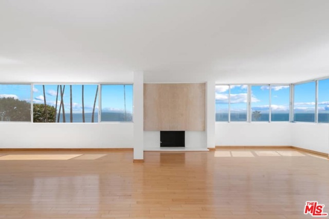17368 W Sunset Boulevard 206 Pacific Palisades, California Irresistible value! Newly priced. Breathtaking Panoramic ocean and coastline views mesmerize from this rare offering- a front, corner northwest -facing 3 bed, 3 bath condo - to make your own at the Luxe Edgewater Towers. The Modern iconic design opens to a grand, luminous & open, flexible living-dining- family space with continuous horizontal planed windows fronting boundless ocean views, a handsome stone fireplace, 9 ft ceilings, & wall to wall birds eye maple floors as well as a galley kitchen with s/s appliances, ample storage, a comfortable breakfast bar and straight-on ocean views. The Functional design incorporates a bedroom wing with private, spacious ensuite master suite with double vanities and full bath, a guest bedroom with built-ins and bath, and adjunct the public space, a 3rd bedroom ensuite with 3/4 bath - all with continuous windows mirroring ever-changing dramatic ocean vistas. Parking is easy -2 subterranean tandem parking spaces & ample guest parking. Enjoy the Edgewater Quality Lifestyle - within a secure concierge gated site- amid lushly landscaped acreage w/ swimming pools, spas, gym, alfresco patios, tennis court & hiking trails. Wake up each morning to the beautiful blue Pacific and finish your day with gloriously, vivid sunsets from your private screening haven.