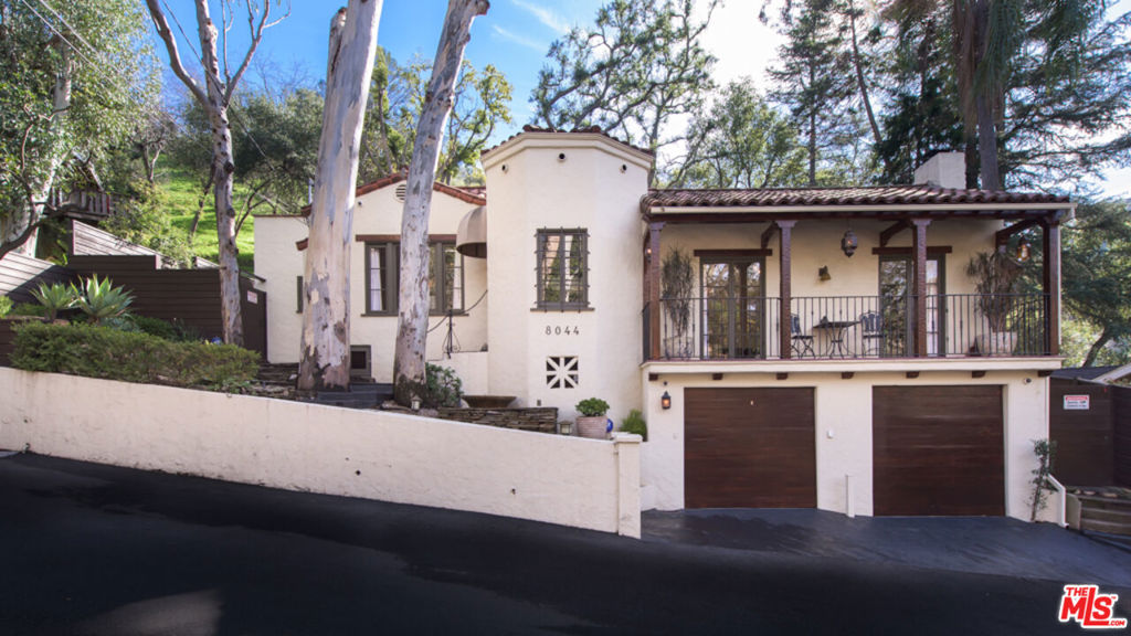 8044 Jovenita Canyon Drive Los Angeles, California On a private street in Laurel Canyon, sits this stunning authentic and updated Spanish Gem. Furnishings are included!! Drive up to quality curb appeal and see the first sign of pride of ownership in this romantic 2 bedroom/2 bathroom villa with a beautiful front balcony. Enjoy working in your at home Casita. Gorgeous hardwood & stone floors. A custom kitchen with island features Viking appliances & wine storage. Dine in the kitchen or move to the formal dining room for dinners with guests. The master bath has a separate shower & large cement bathtub with french windows opening to the lovely outdoor patio with canyon views. The private back patio features a dining area, fireplace, hot tub & barbecue. On its own pad sits a detached bungalow/artist studio with heat/air conditioning. Very private with easy access to both westside & valley amenities. Pretty upper gardens are embellished at night with lighting. Camera and alarm system, Nest. 2 car garage spaces.