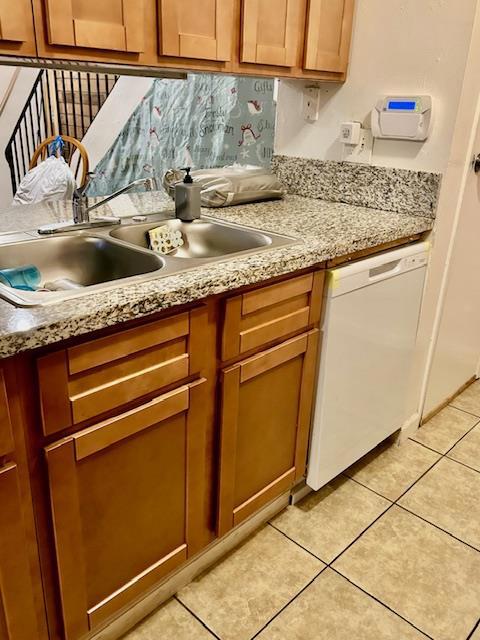 Kitchen with cherry wood cabinets, granite counter tops, electric oven, dishwasher. Pantry.