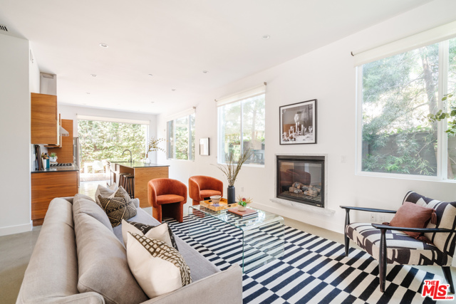 2437 Walnut Avenue Venice, California Incredible space and effortless style will welcome you seamlessly to this timeless Venice Beach residence. Tucked away in a peaceful pocket just two blocks east of Lincoln, this elevated townhouse setting is filled with volume and natural light reminiscent of a single family home. Stunning finishes line the home's interior with walnut woodwork and a mix of concrete and warm, oak hardwood floors blending naturally vibrant tones, effortlessly. Sky high ceilings accented by oversized sliders and picture windows capture ample natural sunlight, inviting the outdoors in for the California aesthetic we all love and behold. Up a soaring staircase, two expansive en-suite bedrooms plus the spacious primary suite all flow graciously together on one floor creating an idyllic layout for a variety of Westside lifestyles. Relax outside in your private backyard garden setting, brilliantly positioned off of the airy & open living space idyllic for hosting, entertaining, and creating in abundance. Easy access to LAX, Abbot Kinney, Rose Ave, Marina del Rey, the palm tree lined Venetian beaches, and all the hottest vibes on the Wetside- home, is here.