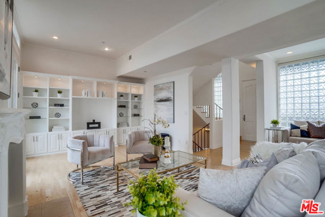 1018 2nd Street 5 Santa Monica, California $200,000 price reduction. Don't miss this opportunity to live 1 block from the beach. Welcome home to this beautiful 2bd 2.5 bath Penthouse. A small 6 unit building sits close to Palisades Park, 3rd street Promenade and just one block from the beach. This stunning light filled unit is ideal for entertaining guests, enjoying dinner/drinks or relaxing with family and friends. There is an inviting rooftop with beautiful views of the ocean and mountains. Maple wood floors, skylights through out, high ceilings, fireplace, crown moldings, built-ins, plantation shutters and French doors to both balconies. The newly remodeled kitchen has granite counter tops with stainless steel appliances and custom Marmol Radziner designed cabinetry. Both bedrooms are located downstairs and are full suites. The master bath has been upgraded with a separate shower and tub. Comes with complete walk in closets and laundry in the hall. Side by side secured parking, extra storage space and a guest spot.