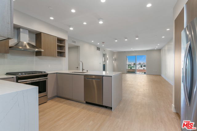 11837 Mayfield Avenue 101 Los Angeles, California Welcome to Reve, a bespoke collection of new residences in Brentwood. Reve delivers impeccably designed living spaces that inspire harmony in a modern home, a place for restorative respite and spectacular sunsets. Residence 101 is beautifully laid out, with a U-shaped kitchen with plenty of pantry space, great for cooking and entertaining. The living room is spacious and has a balcony to act as an extension of the living space. The kitchen has stainless steel appliances including a wine-cooler, In-unit LG washer/dryer, hardwood composite flooring throughout, and pental quartz counters in the kitchen and bathrooms. This residence is facing towards Mayfield Ave on the ground floor, so you have unobstructed views which allows for plenty of natural light to shine through. Master bedroom has private Juliet balcony. This A1 Layout is available from $6500 to $7950 depending on floor level. Includes parking for 2 vehicles. Rooftop lounge, courtyard zen garden, and fitness center on site.