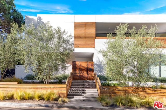 12625 Homewood Way Los Angeles, California Located on a private cul-de-sac on one of Brentwood's most sought after streets, this architectural masterpiece offers modern, yet functional family-style living! Upon entering, you feel a sense of peace as the floor-to-ceiling glass windows flood the large scale rooms with natural light. This sophisticated 8,300sqft showstopper is personal and timeless. The finish materials and fixtures add the perfect dose of desirability to the mix. The main level boasts an enormous chefs kitchen with premier appliances and custom cabinetry. All main floor rooms open seamlessly to the private backyard where you can enjoy the ultimate entertainer's dream, including an incredible pool, yard, basketball court, and BBQ. Head upstairs to find an oversized master suite with two walk-in closets and a spectacular Venetian plaster master bath. Head downstairs by elevator to enjoy your very own wine cellar along with a private theatre and gym. This sensational home captures Brentwood's luxury living!