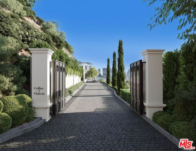 8200 Hillside Avenue Los Angeles, California Behind a private gated entry resides one of the last approx. 1-acre promontories hovering above the legendary Chateau Marmont, with the most explosive views the city has to offer. Not only is there the coolest Hollywood Regency home on the property, but there are also plans by esteemed Architect and Design Studio, Tim Campbell, to build a Parisian-transitional paying homage to the greats of Christian Liaigre and Joseph Dirand. Permit ready plans, grandfathered in prior to the extremely restrictive Wildlife Ordinance, for a 14,000 square foot masterpiece by Studio Tim Campbell and Jason Somers of Crest Real Estate. Once complete, "The Hillside Chateau," will be set behind a long, private gated drive with an oversized motor court. Flawlessly thought out with the most exquisite finishes and floorplan. The interior blends classic design elements with modern touches and the best materials to create a truly remarkable space. High ceilings, cased openings, archways, and long dramatic hallways throughout the home. Seamless indoor/outdoor living with a mega view from all 7 bedrooms. The latest and greatest amenities include a theater with lounge, gym with spa, wine cellar, and a gorgeous auto gallery to highlight your collection. Properties like this don't exist anymore. Here is your chance to own a $50+ million property on the Sunset Strip.
