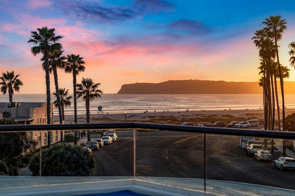 Welcome home…this spectacular, architectural gem is located just steps from the sand in the highly sought after Coronado Beach quadrant. From the main living areas, including the beautiful primary suite, you’ll discover the designers purpose of showcasing panoramic ocean views that turn into magnificent evening Sunsets. This stunning coastal residence masterfully blends luxurious living with contemporary seaside charm. As you step inside, you'll be greeted by a saltwater aquarium, setting the tone for the meticulously designed interior. Featuring 5 bedrooms, 5 bathrooms, over 5,200 square feet of living space and includes an elevator for your convenience. The gourmet kitchen is equipped with double ovens, high-end appliances, and a private prep area perfect for culinary enthusiasts, all while enjoying the ocean views. This home is an entertainer's dream with spectacular indoor & outdoor living areas. Equipped with Smart Home controls for lighting, music, thermostat, and high-speed fiber optic internet to ensure modern comfort and convenience. Enjoy the ocean breezes, sounds of waves and daily whitewater views along with spectacular sunsets from the well-appointed main level and rooftop decks. The roof deck, accessible by staircase, offers an incredible panorama of Coronado Island, extending towards Mexico and the downtown San Diego skyline. Additional luxurious features include a zen backyard with waterfall spa, private secluded gardens with fountains, and six fireplaces throughout the home along with an oversized 2 car garage plus extra off-street parking.  This is a rare opportunity to experience coastal luxury at its finest. Come and embrace the beauty and tranquility of this exceptional Coronado ocean view home.