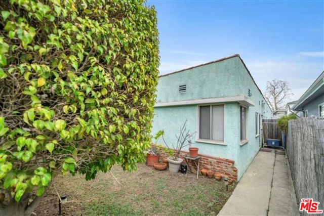 Fantastic Location, quaint California Bungalow takes you back to quiet California living. Building sold as is.