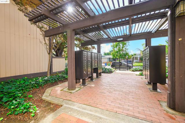 View of patio / terrace featuring a pergola and mail area