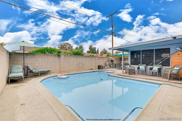 Pool with sundeck/ patio on the right.