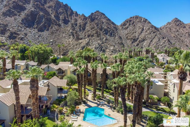 78130 Cortez Lane Indian Wells, California Prime location nestled at the rear of Mountain Cove, embraced by the majestic mountains offering spectacular scenic vistas. Experience true land ownership with fee simple land. Discover this sophisticated and fully furnished two-bedroom, two-bathroom, bi-level condominium that has undergone a complete upscale renovation. Conveniently positioned just a few steps away from the community pool and spa. The lower level showcases an expansive open floor plan featuring a remodeled kitchen boasting exquisite quartz countertops, top-tier appliances, and modern cabinets and drawers. The upper level presents two inviting bedrooms that unfold onto a large, secluded deck providing breathtaking mountain panoramas. Adorned with laminate flooring and soaring cathedral ceilings, this space exudes elegance. From the living room with its generously sized glass doors, step onto the lower level patio and immerse yourself in the delicate scent of jasmine while enjoying privacy while being surrounding by a mature Ficus hedge. Additional highlights encompass tasteful tile flooring, two fully renovated bathrooms featuring contemporary tiled showers and suspended vanities. This remarkable property presents an exceptional opportunity whether as a permanent residence, a vacation retreat, or an investment property. Residents of Indian Wells are also granted exclusive privileges, including substantial discounts at the spa and golf club located at the prestigious IW Resort just across the street.