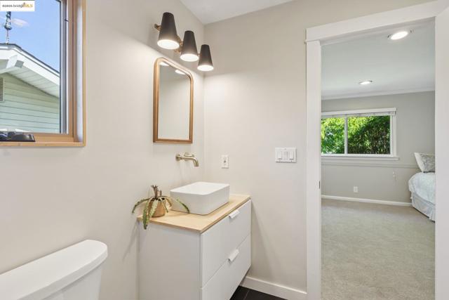 Bathroom featuring vanity, recessed lighting, and crown molding