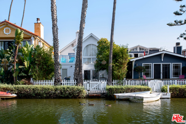 456 Howland Canal Venice, California Ideally located & picture perfect, this home enjoys a beautiful island location in the World-Famous Venice Canal Historical District. This newly renovated coastal cottage provides a unique artists touch combined with quintessential modern living. Kitchen features handpicked Malibu tiles, SubZero Fridge, new kitchen aide white appliances and plenty of storage. Luminous hand-painted wood floors reflect the colors of the Ocean in this bright home. Smart home amenities throughout, operating the fountains, lights, security, garage and doors and more. Upstairs you will find 2 resort-like bedrooms and an office or babies room, 2 full bathrooms, one en-suite master with walk in closet, steam shower and a large deck for enjoying the views. The Mermaid home invites relaxation and privacy alongside the Venice Canals. Walk to the beach, boardwalk, restaurants, the location cannot be beat. 2 car garage plus space for 3 more, a mini boat dock, w/boat + electric motor + battery.