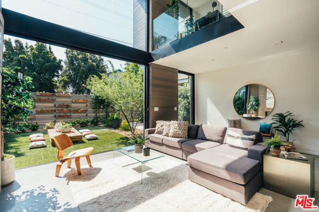 213 Horizon Avenue Venice, California Your ultimate coastal sanctuary awaits at this newly constructed modern paradise, just two blocks in from the sand. The Lion Company presents a captivating contemporary in Venice's beloved Windward Circle. Resting on a street to street lot with parking for 4, this 4 bed 5 bath retreat perfectly combines rich materials with natural tones, creating an inviting and warm palette throughout. Soaring ceilings and double height windows capture an abundance of natural light, bringing the sunny beach vibes within. One of the most substantial master suites in all of Venice, a zen oasis spans across its own entire floor with a gorgeous marble lined spa bath, dual closets, outdoor hot tub and two patio decks. An elevator provides quick access to an oversized rooftop, ideal for entertaining, al-fresco dining, and basking under the sun while enjoying breathtaking views from the coast to the Hollywood Hills. Striking style, the Venice Beach way.