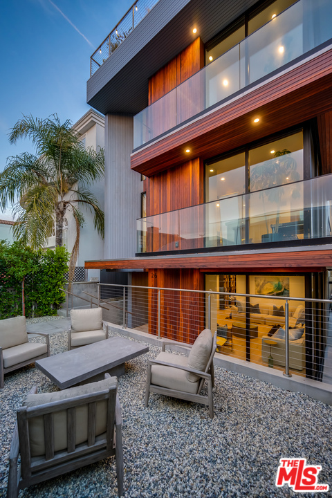 26 30Th Avenue Venice, California Stunning Architectural Beach Home built in 2017 on a lovely walk street only steps to the sand. Incredible light and high ceilings throughout with 4 bedrooms all en-suite, powder room, media room, den + nearly 2,000 square foot rooftop deck with 360 views from Catalina to Malibu + an elevator that goes to all levels. The grand room boasts a spacious living room and den with a chef's kitchen in the middle - customized with sea pearl quartzite counters, walnut cabinetry, Miele appliances and built in kitchen table. The living room sliders go into the wall as a pocket so the room feels as though you are outside with incredible ocean breezes. The master suite is facing the walk street with an enormous walk-in closet & gorgeous spa like bathroom. This home is thoughtfully designed with very private comfortable spaces and large open community spaces. Walking distance to many shops, restaurants, the canals and Abbott Kinney. Can be purchased with all furnishings included.