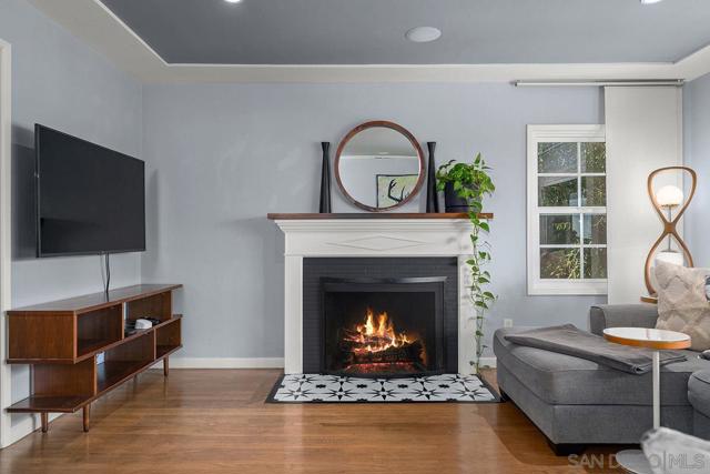 living room with wood burning fireplace.