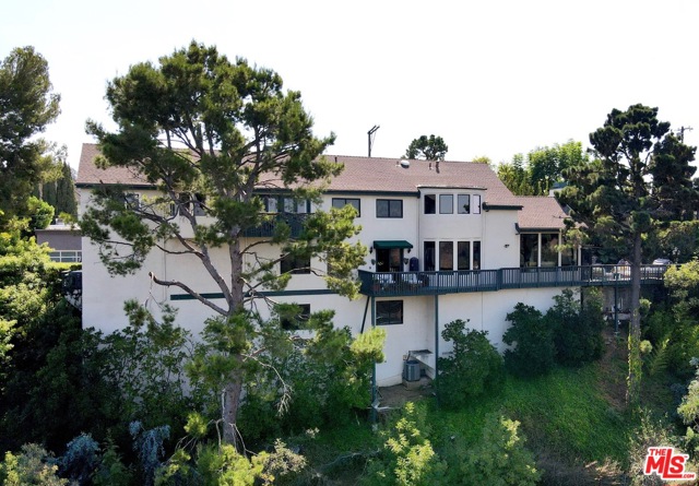 2251 Gloaming Way Beverly Hills, California Very desirable location, minutes away from Rodeo Dr & The Beverly Hills Hotel. French doors lead to a Zen Garden. Featuring wood floors, 2 fireplaces, a large owner's suite w/ private deck, new large bathroom, amazing Canyon views, & a 3 car attached garage. A perfect hideaway with green all around - a must see property! The quoted lot square footage includes adjoining parcel.
