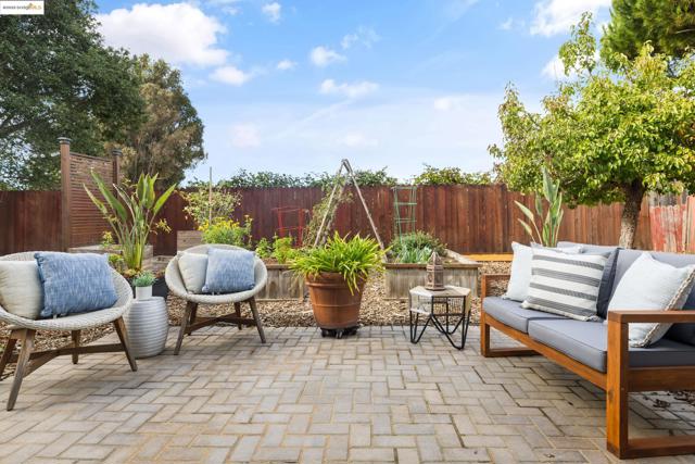 Fenced backyard with a patio area