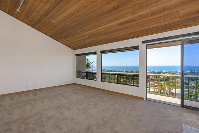 Beautiful wood ceilings, panoramic ocean views, gas fireplace, and outdoor deck.