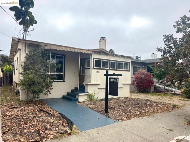 View of front of home featuring a chimney
