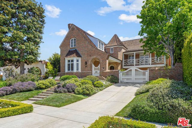 533 18Th Street Santa Monica, California One-of-a-kind English Country Manor on 18th Street exuding privacy, charm and character in Gillette Regent Square. Nearly 5,200 sqft of living space on two levels, including 5 bedrooms set on 8,930 sqft lot, surrounded by towering hedges, mature trees and magical garden. Front yard sets the tone with lush landscaping and private patio leading up to porch entrance. Backyard includes huge patio/outdoor living space with built-in outdoor kitchen/BBQ with architectural iron pergola. Living room has amazing height with crown moldings and hardwoods floors throughout. Spacious updated kitchen with center island & stainless-steel appliances opens to a huge formal dining room on one side and spacious breakfast nook on the other. Huge floor-to-ceiling sliding doors create an indoor-outdoor feel and provide abundant light. Upper level has four bedrooms including romantic master suite with vaulted ceilings and fireplace, dual walk-in closets and white marble bath, complete with clawfoot bathtub. Jack and Jill bedrooms adjoin the master while a second junior suite creates its own unique space. Hardwood floors throughout. Impeccably curated home that represents a rare opportunity to enjoy the best of Santa Monica. Move-in ready!
