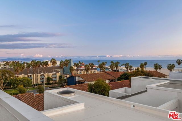 2950 Neilson Way 601 Santa Monica, California Beautifully remodeled, 2-bed, 2-bath modern loft penthouse in Sea Colony II. One of the best units available in over 35 years. Fantastic ocean, mountain and city light views from every window plus a private ocean view patio off the loft. The 2nd balcony off the living room, the 25 ft. high ceilings, skylights, and a stylistic light and open floor plan, provides a unique beachfront environment. Impeccable upgrades include: Oak hardwood floors, custom kitchen with Italian stone countertops, recessed lighting and skim coated smooth walls throughout. Other features include: Laundry inside unit, two side by side gated parking spaces, guest parking, 3 community spas, pool, gym, rec. space, an onsite manager, security and concierge. This exceptional location between the Venice and Santa Monica Piers provides a rare opportunity to have birds eye views of the ocean and Santa Monica's Main Street. Hear the ocean waves and watch spectacular sunsets while living in a secure and private setting.