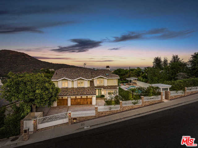 16598 Via Floresta Pacific Palisades, California Located in the prestigious Marquez Knolls neighborhood of Pacific Palisades, this ultra-private residence is situated on one of the largest view properties in the area, capturing sweeping canyon and city vistas. With 3 gated entrances, the recently remodeled home is set amidst vegetable & herb gardens and a fruit orchard, ideal for growing your own in the comfort of home. Light-filled living spaces showcase expansive windows, including the open chefs kitchen with ample counters & premier stainless steel appliances. Interiors open to spacious view terraces, 8-person fire pit lounge, lush grass yard, saltwater pool/spa, outdoor kitchen/BBQ, shower & cascading stone waterfall. Steps descend down the hillside to the gardens, sandy play area & patio. 6 bedrooms include 2 master suites with a wraparound view balcony. Features include a Carrera marble master bath, hardwood floors, den and 3-car garage, located moments from premier beaches, hiking trails, Temescal Beach & Palisades Village.