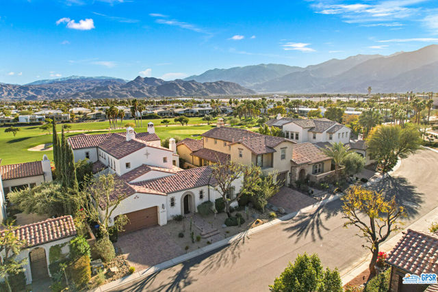 The perfect mix! Seldom to market! One of Palm Springs' most sought-after golf communities! South-facing and atop the 7th fairway. Spanish-Colonial Revival meets San Jacinto views at Nicklaus designed Escena Golf Club. 3BD, 3BA + den and 3,598 SF. French doors open to beautifully designed terraces and pool framing the two-story formal dining room with bar. Beamed ceilings, stone fireplace, and flawless finishes accentuate an already magnificent living room and chef's kitchen. Wonderful outdoor conversation areas are a theme all around the home. A stunning portico runs along the pool and the mood is set! An outdoor stone fireplace glows beautifully at night. Bedrooms enjoy plenty of separation. En suite primary is located on the second floor. Views from this balcony work their MAGIC. Spa-inspired primary bath with dual vanities, double shower, and large walk-in closet. Guest bedrooms are positioned on the main floor. En suite Guest #1 opens to a patio fronting the fairway. Built-in cabinets are found throughout. The upstairs den's handsome bookcases surround the fireplace. Polk audio system in place. Low HOA fees are a plus! Numerous dog parks at Escena offers a glimpse of the lifestyle. Escena Golf Club's Lounge and outdoor Grill are a hit. The best of Palm Springs is a short hop away. You've arrived. Enjoy it all!