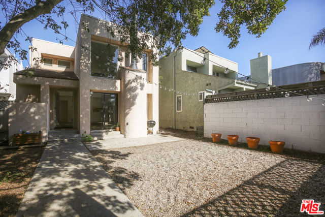 2408 Pacific Avenue Venice, California Spectacular Architectural 3-bedroom, 2.5 bath + rear studio with full kitchen and bath. Freshly remodeled and only one block to the beach, just off the Venice Canals. Upon entering the private entry gate, you are greeted by an oversized yard, perfect for gatherings or just relaxing in the hammock. The home features an open floor plan with an abundance of light from the soaring two story living room windows. There is a powder room on the first level along with a dining area and kitchen with stainless appliances. The second-floor features designer bathrooms, 3 bedrooms and an oversized master suite with a spa bathroom, walk-in closet and a view of the canals and Hollywood Hills beyond. The 4+-car covered parking is located off S. Strongs Drive. The rear studio has a kitchen, bath, fireplace and oversized balcony. This private oasis is just a short walk to world-class restaurants and shopping, the Venice boardwalk, bike bath, trendy Abbott Kinney (voted the coolest street in Los Angeles) and 1 block to the ocean.
