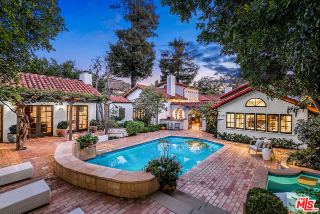 178 N Carmelina Avenue Los Angeles, California Designed by the esteemed architect Marc Appleton, 178 N Carmelina Ave exudes luxury and poise showcasing the perfect blend of hues and textures throughout the 4,690 square feet of custom living space. Set behind gates in Brentwood, the main house features 4 bedrooms, 6 bathrooms, multiple living rooms, formal and informal dining, and an office. The beautifully designed open floor plan allows for a seamless flow from the chef's kitchen with pitched wood beam ceilings and top-of-the-line appliances into the informal dining area with great lounge space. An abundance of natural light flows into the living room through French doors that look out to the romantic outdoor dining space. The spacious and bright Master Suite with a dark wood pitched beam ceiling, fireplace, 2 walk-in closets, 2 bathrooms and a sauna offers direct access to the backyard through French doors. Surrounded by beautiful greenery and manicured landscape, the backyard is an entertainer's dream hosting a pool, spa, dining area, lounge space and a detached 1bd,1ba guest house.