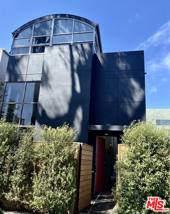 1523 Cabrillo Avenue Venice, California SERENE RETREAT HOUSE IN TOWN This warmly fully furnished well appointed home away is available short or long term and is easy to show. Quiet street off of Abbot Kinney in Venice Beach CA. Treetop views of hawks nest, outdoor hot tub. high ceilings, large windows blasting light everywhere, fireplace, private patios & balconies. Walkable to everything fun, food, shopping, beach. Monthly is negotiable for long term lease.