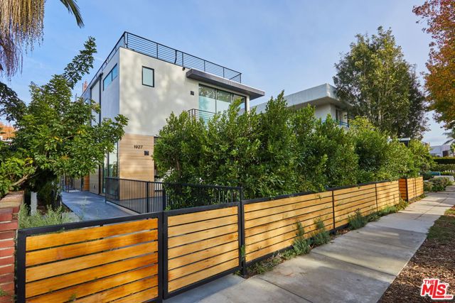 1927 18th Street C Santa Monica, California Don't miss this luxurious new construction townhome offering the latest in sleek, contemporary design in a convenient Santa Monica location. This back unit feels like a home complete with 3 bedrooms, 4.5 baths, an office AND a basement which could act as a guest suite, den or gym. Living, kitchen & dining area offer an open floor plan with high ceilings and oversized Fleetwood sliding doors leading to outdoor area. Gourmet kitchen complete with custom cabinetry, quartz countertops and top-of-the-line appliances including a Chef's six burner range. Spacious Master features his/her walk-in closets, spa-like Master Bath w/Walter Zanger marble shower and stand-alone soak tub. Top it off with a rooftop deck with spectacular views.Also features: 2 car garage, European wide oak floors through-out, Restoration Hardware light fixtures, Anne Sachs tile, high-end Kohler fixtures & ample outdoor space.Central location close to beach, Whole Foods 365, SM College&Main Street! Home Sweet Home!
