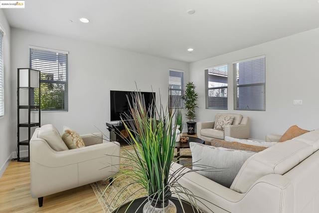 Living room featuring light wood-type flooring and recessed lighting