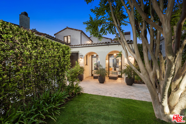 229 22ND Street Santa Monica, California Private and quiet, set up from the street behind hedges, this contemporary Spanish with its graceful arches and high end finishes brings indoor/outdoor living to a new level. The North of Montana location on one of the prettiest tree lined streets, is a few short blocks from the Brentwood Country Mart. The open floor plan and high ceilings create a spacious and light filled ambiance. French doors in the living room, breakfast area, family room, primary and secondary bedrooms open to separate outdoor spaces. The side facing patio with its barbecue and outdoor kitchen is just right for every day dining, while the backyard with its firepit and built -in wrap around sofa and gorgeous new landscaping feel like an oasis. There are four ensuite bedrooms, including three up and one down; one of them has been converted to a walk-in closet (easily converted back if needed), a separate home office, dining room, family room and chefs kitchen with center island and breakfast area. Its a small big house or a big small house and it offers something different, unique and special. California living at its best plus move-in ready.