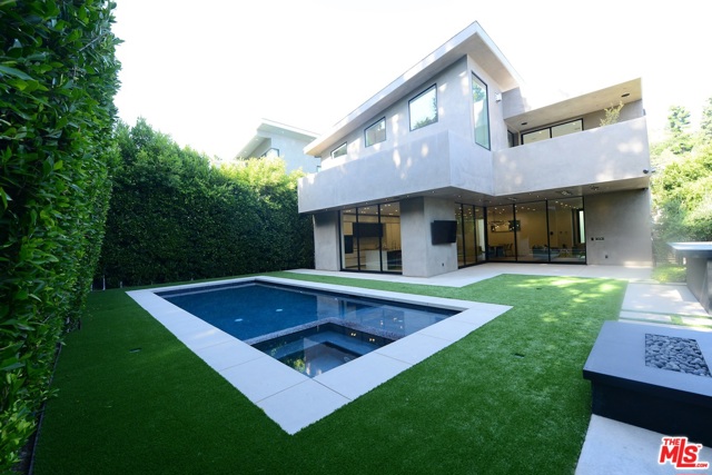 1845 Coldwater Canyon Dr Beverly Hills, California This sophisticated modern home just hit the market. Its a very elegant residence with high ceilings, glass walls emerging outdoor space into indoor living so popular in California, plenty of spacious extra rooms as office,den, guest and maids quarter,movie theater,two enormous master bedrooms, two bars, entertainment room etc. Huge patio and true gallery windows with amazing views throughout. Secluded back yard with a large sparkling pool, spa, build-in full kitchen is great for the big parties. Being built just two years ago this gem in BHPO provides all brand new high fixtures everywhere you might just think of.Elevator, Smart house, surrounding sound system, top of the line appliances. Adorable and mainly affordable Beverly Hills house of dream.