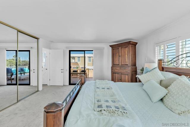 Oversized primary bedroom with Bay views and direct access to rear deck.