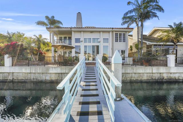 This South facing property enjoys a 5,000 Sq Ft lot with over 50' of waterfrontage and boat slip that can be home to multiple water toys and a yacht. There is a tremendous amount of natural light from all angles, including the two story floor to ceiling windows in the living rooms vaulted ceilings. There are beautiful channel views from all the living areas including the expansive family room. Updated in many areas, this homes kitchen has dark cabinetry with light colored Corian counter tops and back splashes, stainless steel appliances and a beautiful 5 burner electric stove and double oven. There are 3 Bedrooms upstairs including the master bedroom and a full bedroom with a full bath downstairs plus a powder room. The fully finished 3 car garage has a nice storage area above. The Cays has so much to offer, toping that list how beautifully outdoor sports and water sports can be enjoyed along with peace and quiet not offered by many places. This property is also located a short walk to Silver Strand State Beach, Multiple Tennis Courts, Calypso Café, Coronado Cays Yacht Club, Loew's Coronado Bay Resort and 4 miles into Coronado Village.  This South facing property enjoys a 5,000 Sq Ft lot with over 50' of waterfrontage and boat slip that can be home to multiple water toys and a yacht. There is a tremendous amount of natural light from all angles, including the two story floor to ceiling windows in the living rooms vaulted ceilings. There are beautiful channel views from all the living areas including the expansive family room. Updated in many areas, this homes kitchen has dark cabinetry with light colored Corian counter tops and back splashes, stainless steel appliances and a beautiful 5 burner electric stove and double oven. There are 3 Bedrooms upstairs including the master bedroom and a full bedroom with a full bath downstairs plus a powder room. The fully finished 3 car garage has a nice storage area above. Complex Features: ,,, Equipment:  Dryer,Garage Door Opener, Washer Sewer:  Sewer Connected, Public Sewer Topography: LL Frontage: Bay