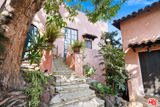 1903 Orchid Avenue Los Angeles, California Las Orquideas is an Andalusian Garden Village nestled at the base of the Hollywood Hills, near the iconic Magic Castle. This compound features five villa-like duplexes consisting of ten legal units (two units have been combined to create one spacious owner's unit). In addition, there is a non-conforming single unit. The owners are looking into the possibility of an ADU, which would be the 11th unit. This whimsical complex was designed in the early days of the Golden Era of Hollywood by Wilfred Buckland, Cecil B. DeMille's frequent art director. Buckland, the original owner designed the property for himself as a replica of a Spanish hill town with ascending walkways, connecting gardens, and intimate plazas. Each villa-like duplex is covered in coral-colored stucco and features original architectural period details such as interior arches, beamed ceil, fireplaces, wood floors, and stained glass. Lofty ceiling heights and oversized windows bring in much natural light. An abundance of lush mature landscaping lines the stone walkways. Las Orquideas is a Mills Act property with a financial incentive for historic preservation, offering property tax savings for owners who invest in rehabilitating historic buildings. A part of the Golden Era Collection, four impeccably restored multifamily complexes in prime Los Angeles locations.