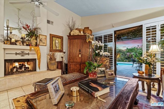 Looking out to covered patio, tiki bar and pool/spa