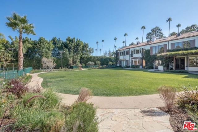 706 N Canon Drive Beverly Hills, California The greatest estate property in the Flats! 1.2 Lush and private acres. One of the most prized (and largest) properties in Beverly Hills, this nearly 11,000 square foot updated Mediterranean style residence sits on a double lot nearly impossible to replicate. Built by McCoy in 2000, the home features 7 bedrooms, 7 full bathrooms and two half baths, as well as a 1 bed 1 bath guest house. The interior boasts dramatic scale with a formal living, dining room, double height great room, chef's kitchen with breakfast bar, large butler's pantry, and screening room. The master with a fireplace, features luxurious dual bathrooms and oversized walk-in closets. The property also includes 2 swimming pools, a lighted sports court, garages for 5 cars and is a short walk to the shops and restaurants of Beverly Hills.