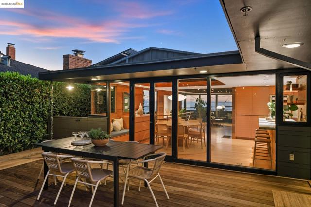 Wooden deck featuring outdoor dining area