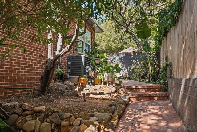 Side of home walk-way can enter from front gate or backyard.