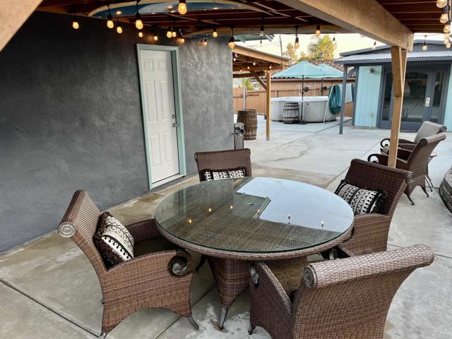 Back patio by garage and outdoor bathroom