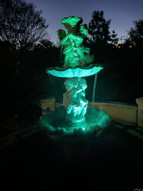 Garden fountain is a lovely water feature surrounded by citrus trees.