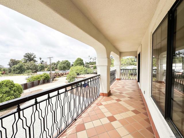 Primary bedroom balcony overlooking front yard