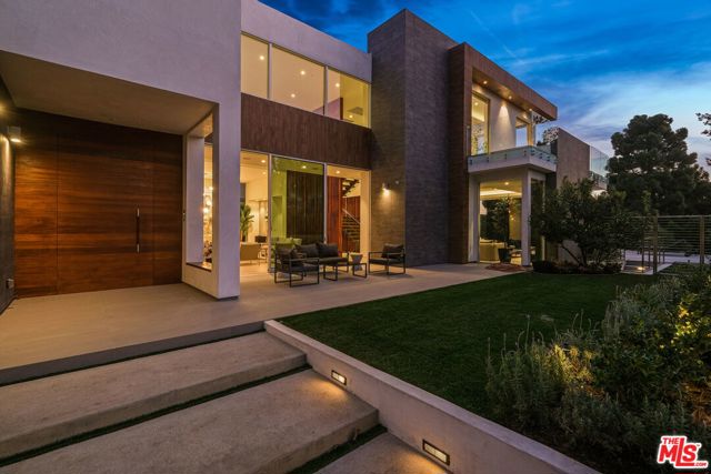 1420 Georgina Avenue Santa Monica, California A modern masterpiece featuring over 10,000 interior square feet of bespoke design on one of the most coveted streets in the prestigious North of Montana neighborhood of Santa Monica. A push of a button opens 25 foot Fleetwood sliders creating uninterrupted flow from the custom kitchen and grand living room to endless outdoor entertaining, infinity pool and barbecue area. A double height entry and 30 foot wall of intricate walnut accentuate a floating staircase leading to the top floor owner's suite with private terrace and views of the Santa Monica Mountains. Five additional en-suite bedrooms, a movie theater, gym and office are all appointed with precision craftsmanship and custom finishes. Additional home features include a comprehensive Crestron home automation system. 2,300 square foot underground auto gallery with rotating electric carousel, Fleetwood windows and doors, electric shades throughout, Cambridge elevator, Meile and Sub-Zero appliances, , electric pool cover, water purification system and tankless water heaters, Agenta pivot hinges and solid walnut doors, electric skylights and more.
