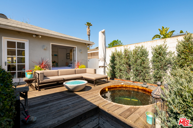 2424 Clark Avenue Venice, California Silver Triangle Charm! This 2 Bed, 1 Bath (+ Bonus room/garage) single family home is situated in one of the most desirable neighborhoods on the Westside! Other features include a spacious deck and built-in jacuzzi! Enter through a beautifully landscaped outdoor space and onto stunning hardwood floors. Living room features a fireplace and large bay window. Kitchen includes stone counter-tops, built-in Thermador, Miele and Wolf appliances and a spacious island. The master bedroom features high ceilings, a walk-in wardrobe, a skylight and direct access to the beautiful front yard. The second bedroom opens to the backyard oasis with built-in wooden spa, deck, fire pit and barbecue. The 1 car garage is perfect as a bonus room, office or home gym (includes AC). Located in one of the most sought after areas in Venice!